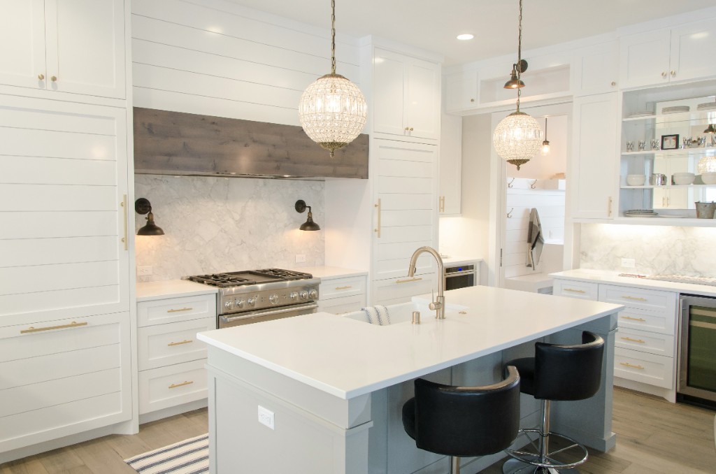 Bright remodeled kitchen with a large island and pendant lighting
