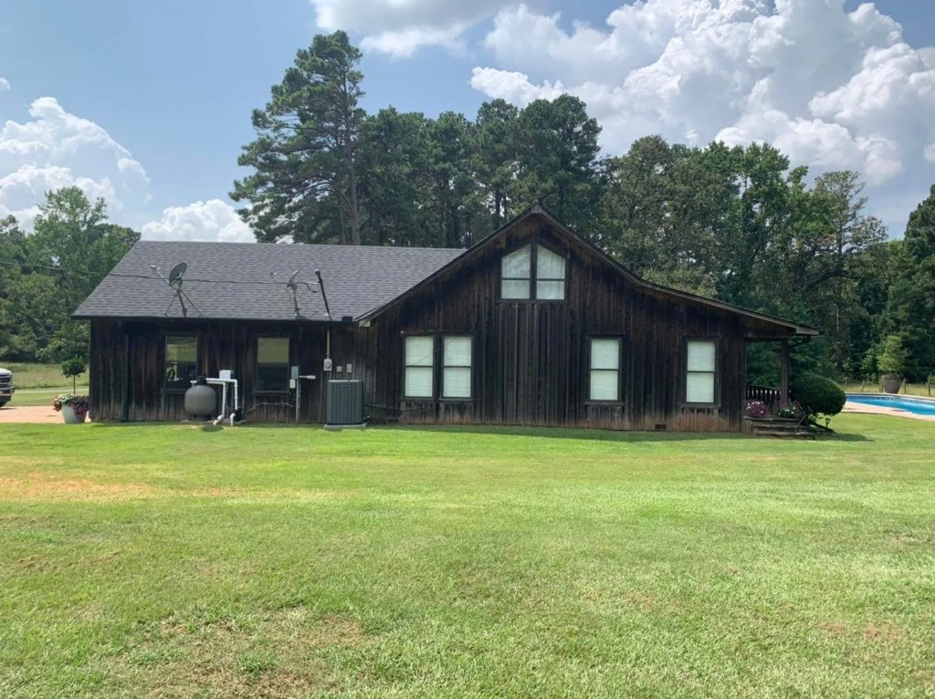 Roof replacement in progress on brick home